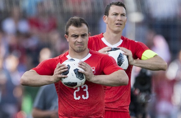 Switzerland&#039;s Xherdan Shaqiri, front, and Stephan Lichtsteiner, behind, with a ball problem during an international friendly soccer match in preparation for the upcoming 2018 Fifa World Cup in Ru ...