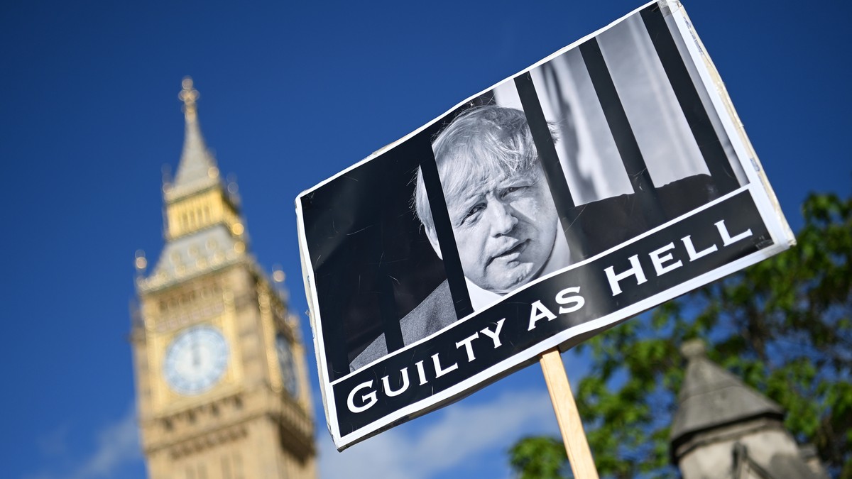 epa09975097 A protester demonstrates against the Downing Street parties, outside parliament in London, Britain, 25 May 2022. British Prime Minister Boris Johnson is under pressure over 'party gat ...