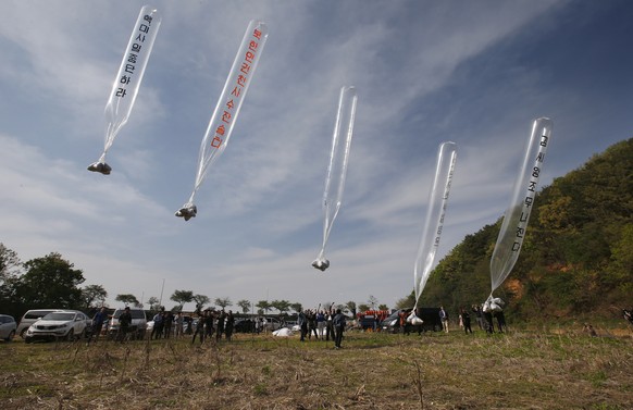 epa08464208 (FILE) - Members of Fighters for Free North Korea, an organization of defectors from North Korea, send balloons carrying anti-Pyongyang leaflets across the border from the South Korean bor ...