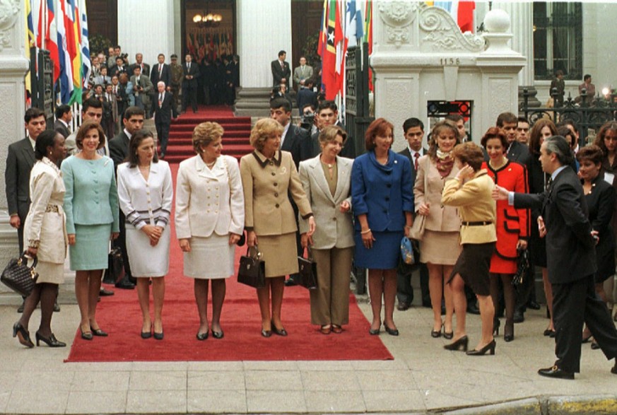 Elizabeth Aguirre, first lady of El Salvador arrives late for the group photo at the closing session at the Foreign Ministry Building during the second Summit of the Americas in Santiago, Chile, Sunda ...