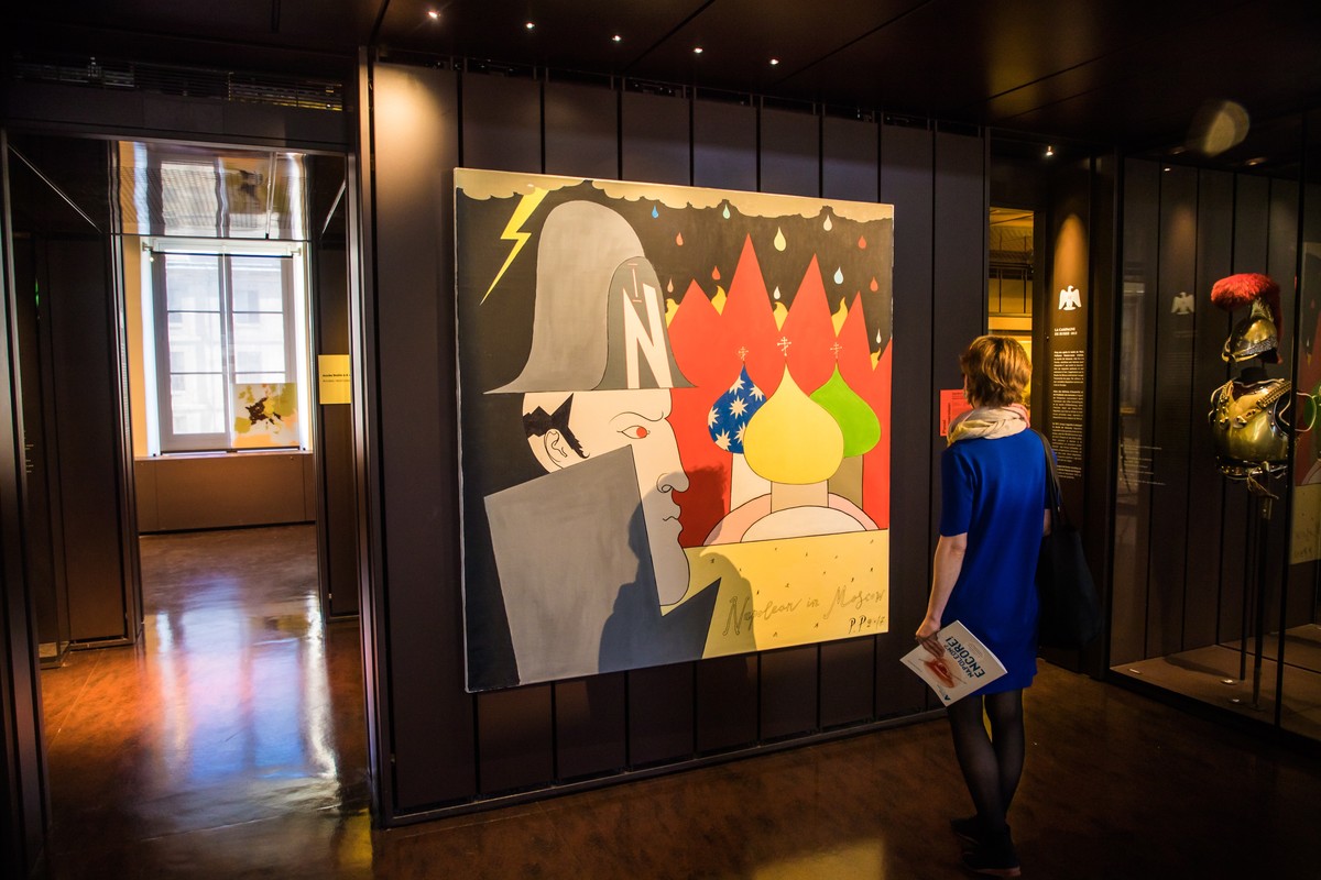 epa09182786 A visitor looks at a painting of Russian artist Pavel Pepperstein 'Napoleon in Moscow' during a press visit of the exhibition 'Napoleon? More! hosted at the Musee de l' ...