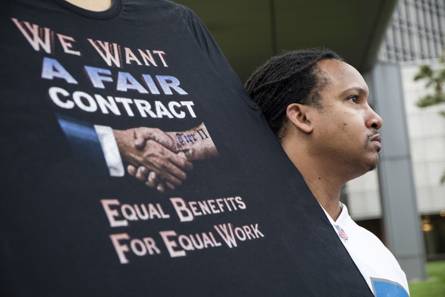 Sean Crawford, of United Auto Workers 598, rallies outside the Marriott Renaissance Hotel while the UAW GM Council holds a meeting inside the hotel in Detroit, Sunday Sept. 15, 2019. The United Auto W ...
