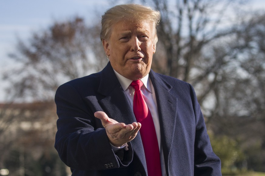 President Donald Trump speaks on the South Lawn of the White House as he walks from Marine One, Sunday, Jan. 6, 2019, in Washington. Trump returned from a trip to Camp David. (AP Photo/Alex Brandon)