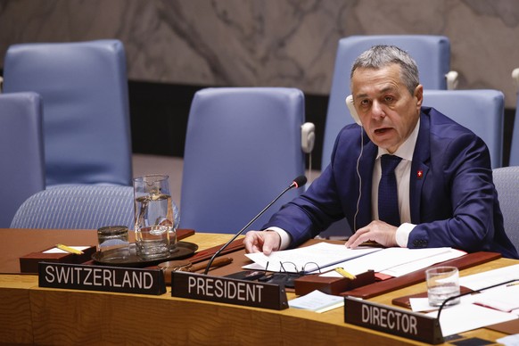Ignazio Cassis (L) Federal Councillor and Head of the Federal Department of Foreign Affairs of Switzerland speaks during a United Nations Security Council meeting on the situation in the Middle East,  ...