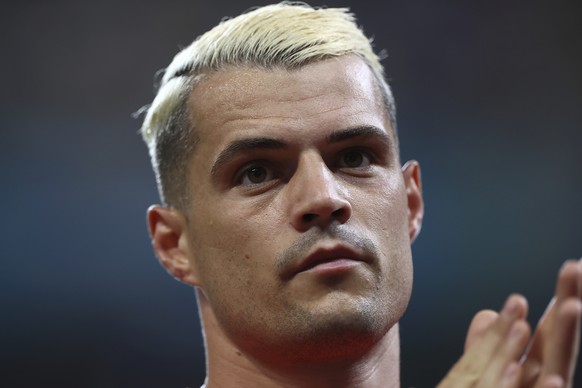 Switzerland&#039;s Granit Xhaka applauds fans as warms up ahead of the Euro 2020 soccer championship round of 16 match between France and Switzerland at the National Arena stadium, in Bucharest, Roman ...