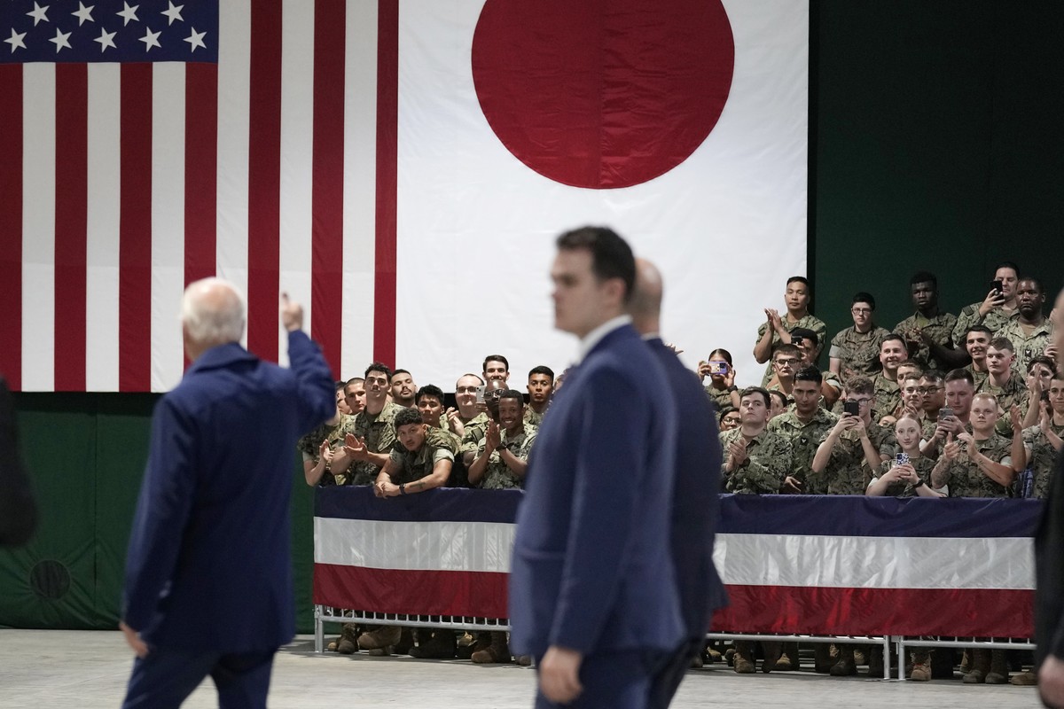 President Joe Biden gives a thumbs up to military members as he leaves Marine Corps Air Station Iwakuni in Iwakuni, Japan, Thursday, May 18, 2023, during a visit. Biden made the stop on his way to att ...