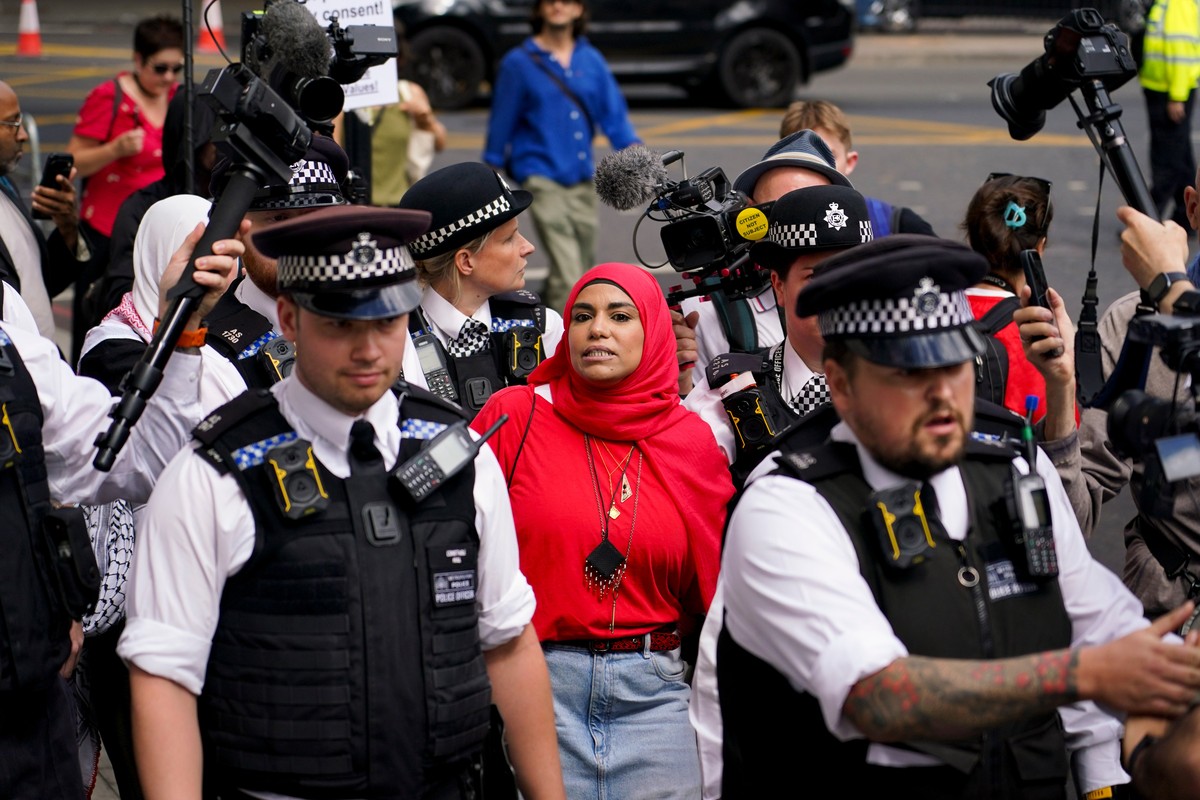 A demonstrator is carried by the police outside the Westminster Magistrates Court in London, Thursday, July 30, 2026, as a plea hearing for 25 people accused of showing support for Palestine Action ta ...