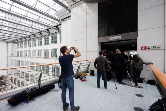 epa11324476 Media personnel wait in front of a sealed-off gangway as investigators search the offices of AfD politician Maximilian Krah in the European Parliament in Brussels, Belgium, 07 May 2024. In ...