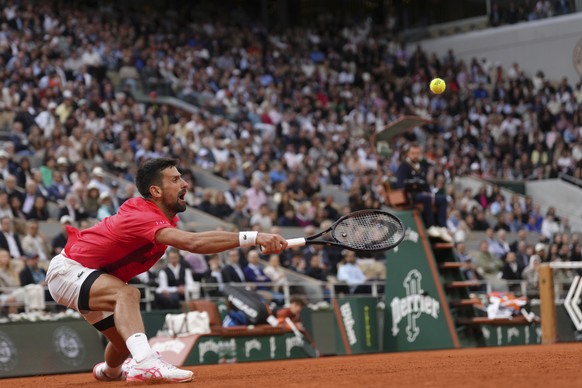 Serbia&#039;s Novak Djokovic plays a shot against Italy&#039;s Jannik Sinner during their semifinal match of the French Tennis Open at the Roland-Garros stadium in Paris, Friday, June 6, 2025. (AP Pho ...