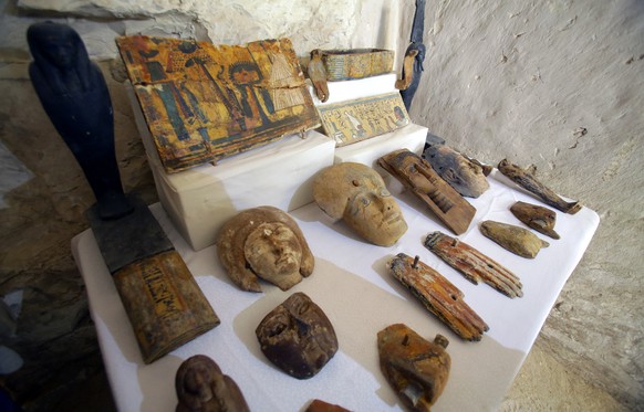 epa07186785 A view of wooden masks outside the newly discovered tomb at al-Assassif Necropolis, in Luxor, 700km south of Cairo, Egypt, 24 Novmber 2018. The tomb of the overseer of the mummification sh ...