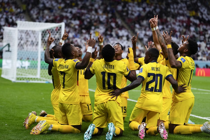 Players of Ecuador celebrate after Ecuador&#039;s Enner Valencia scored their side&#039;s opening goal against Qatar during a World Cup group A soccer match at the Al Bayt Stadium in Al Khor , Qatar,  ...