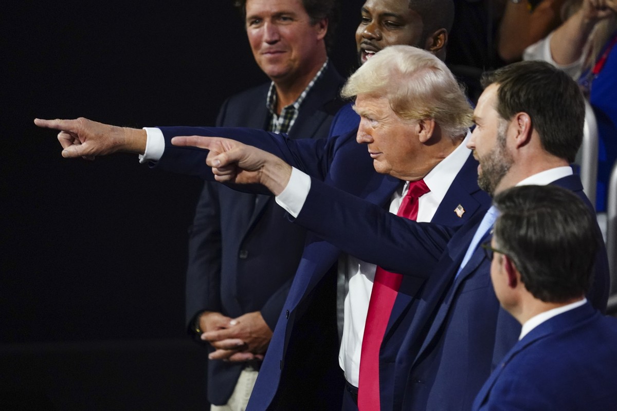 epa11480797 Republican presidential nominee and former President Donald J. Trump (2-L), with Vice presidential nominee JD Vance (2-R), arrive during the evening session of the Republican National Conv ...