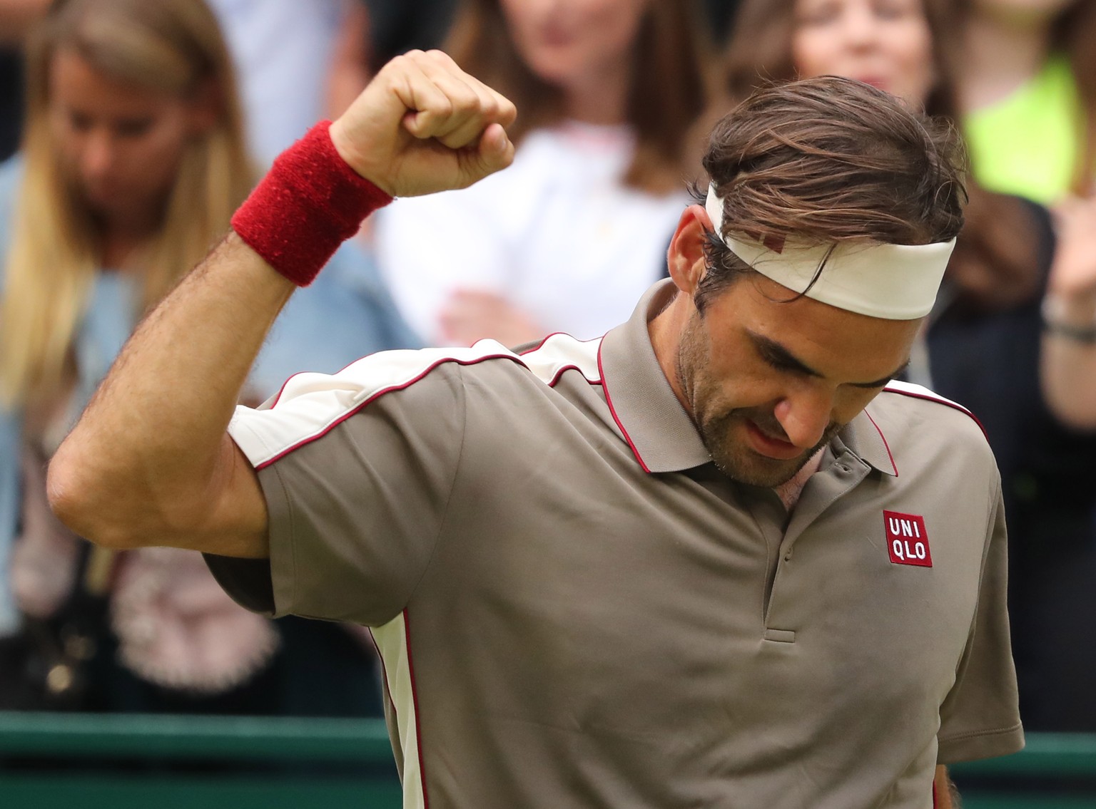 epa07661317 Roger Federer from Switzerland celebrates after winning the round of sixteen match against Jo-Wilfried Tsonga from France at the ATP Tennis Tournament Noventi Open (former Gerry Weber Open ...