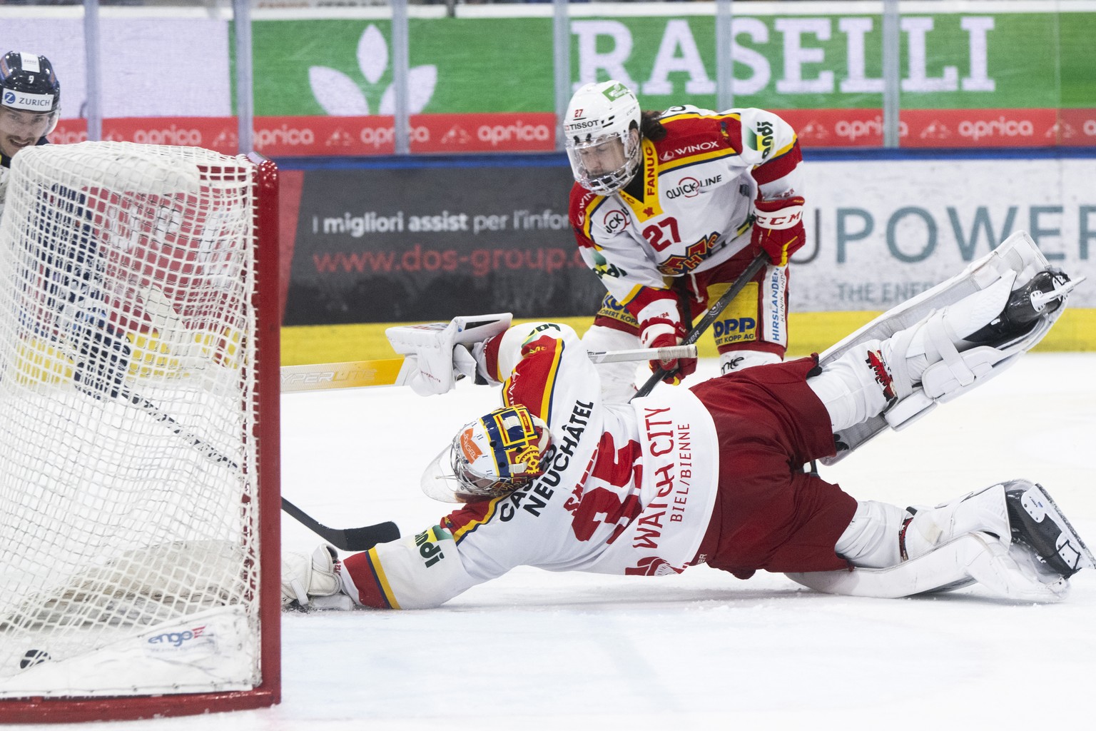 Ambri&#039;s player Laurent Dauphin score the 2-3 goal against Biel&#039;s goalkeeper Harri Saeteri, during the Play-in game of National League A (NLA) Swiss Championship 2023/24 between HC Ambri Piot ...