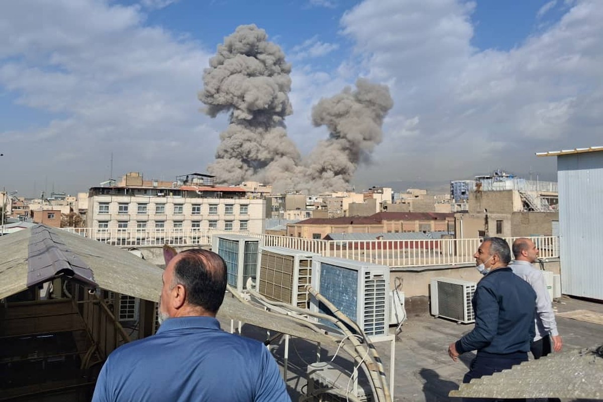 People watch as smoke rises on the skyline after an explosion in Tehran, Iran, Saturday, Feb. 28, 2026.(AP Photo)
APTOPIX Iran US Israel