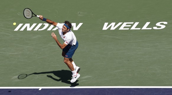 epa07440694 Roger Federer of Switzerland in action against Hubert Hurkacz of Poland during the BNP Paribas Open tennis tournament at the Indian Wells Tennis Garden in Indian Wells, California, USA, 15 ...