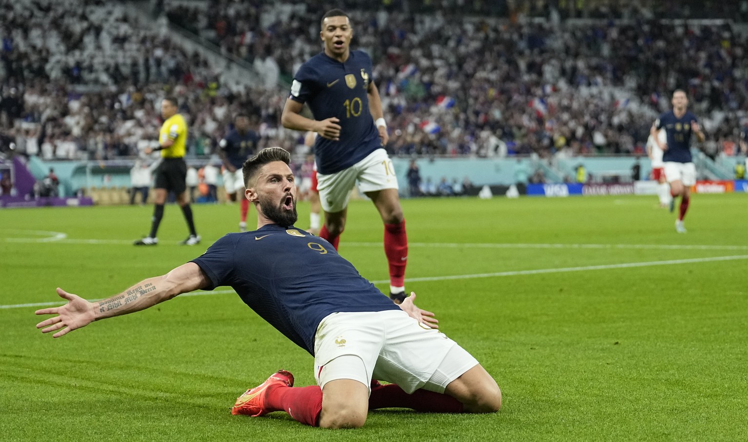 France&#039;s Olivier Giroud celebrates after scoring the opening goal during the World Cup round of 16 soccer match between France and Poland, at the Al Thumama Stadium in Doha, Qatar, Sunday, Dec. 4 ...