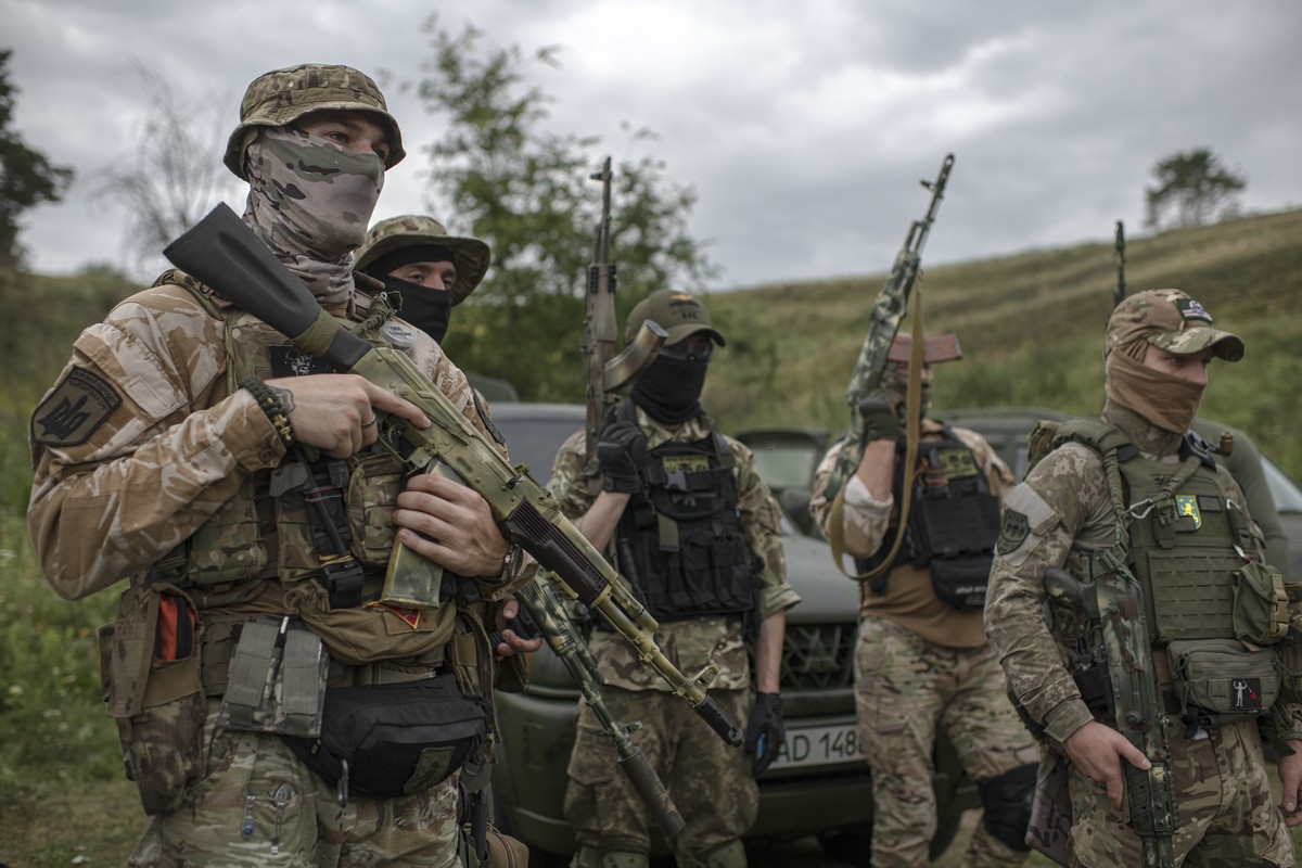 Volunteer soldiers attend a training outside Kyiv, Ukraine, Saturday, Aug. 27, 2022. Some volunteers signed up to join a Chechen unit that fights alongside the Ukrainian military. Fighters from Chechn ...