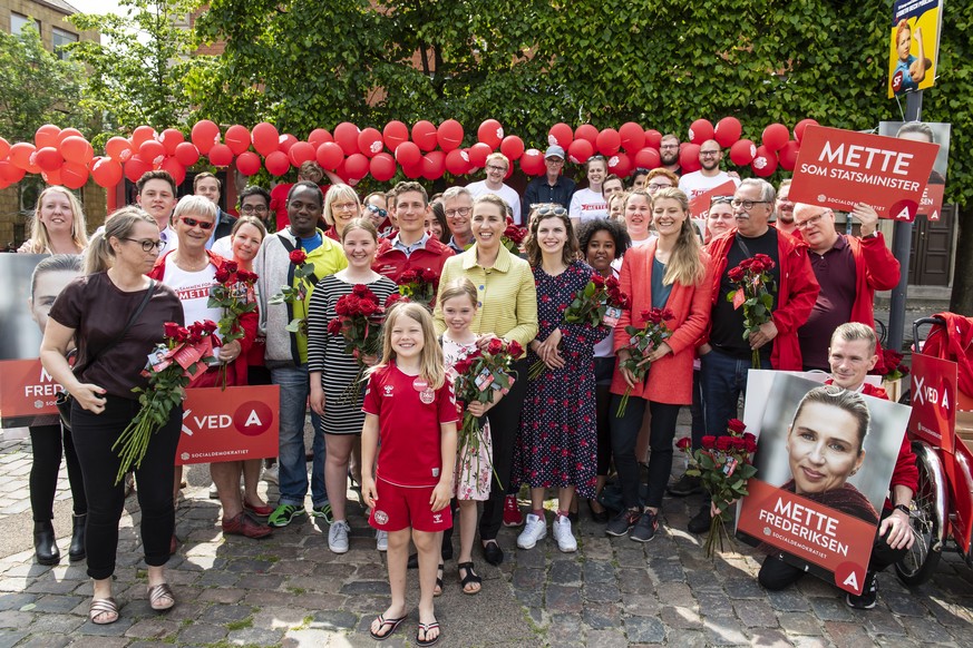epa07627558 Opposition leader Mette Frederiksen from The Danish Social Democrats is meeting voters and is handing out roses in Aalborg, Denmark, 05 June 2019. Denmark is hading to the polls to elect a ...