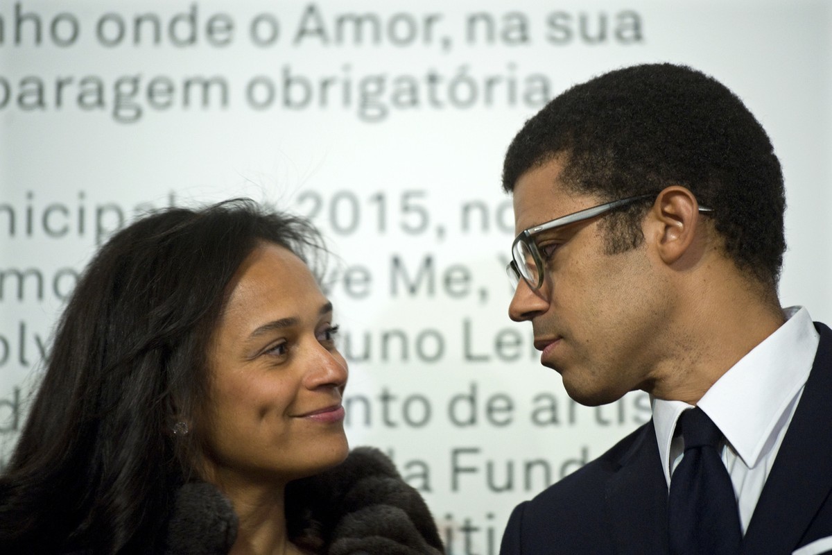 In this March 5, 2015 photo, Isabel dos Santos, reputedly Africa's richest woman, looks at her husband and art collector Sindika Dokolo during the opening of an art exhibition featuring works fro ...