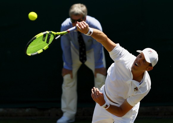 epa06067683 Sam Querrey of the USA in action against Nikoloz Basilashvili of Georgia during their second round match for the Wimbledon Championships at the All England Lawn Tennis Club, in London, Bri ...