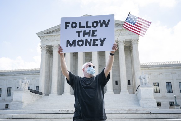 epa08536688 Bill Christeson protests outside the Supreme Court as it rules on two cases seeking to acquire President Trump&#039;s financial records, including his tax returns, in Washington, DC, USA,  ...