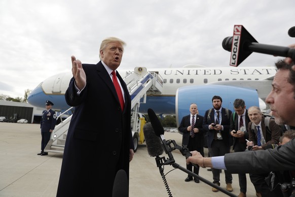 President Donald Trump delivers a statement on Pastor Andrew Brunson after landing at Cincinnati Municipal Lunken Airport, Friday, Oct. 12, 2018, in Cincinnati, Ohio. The president is en route to camp ...
