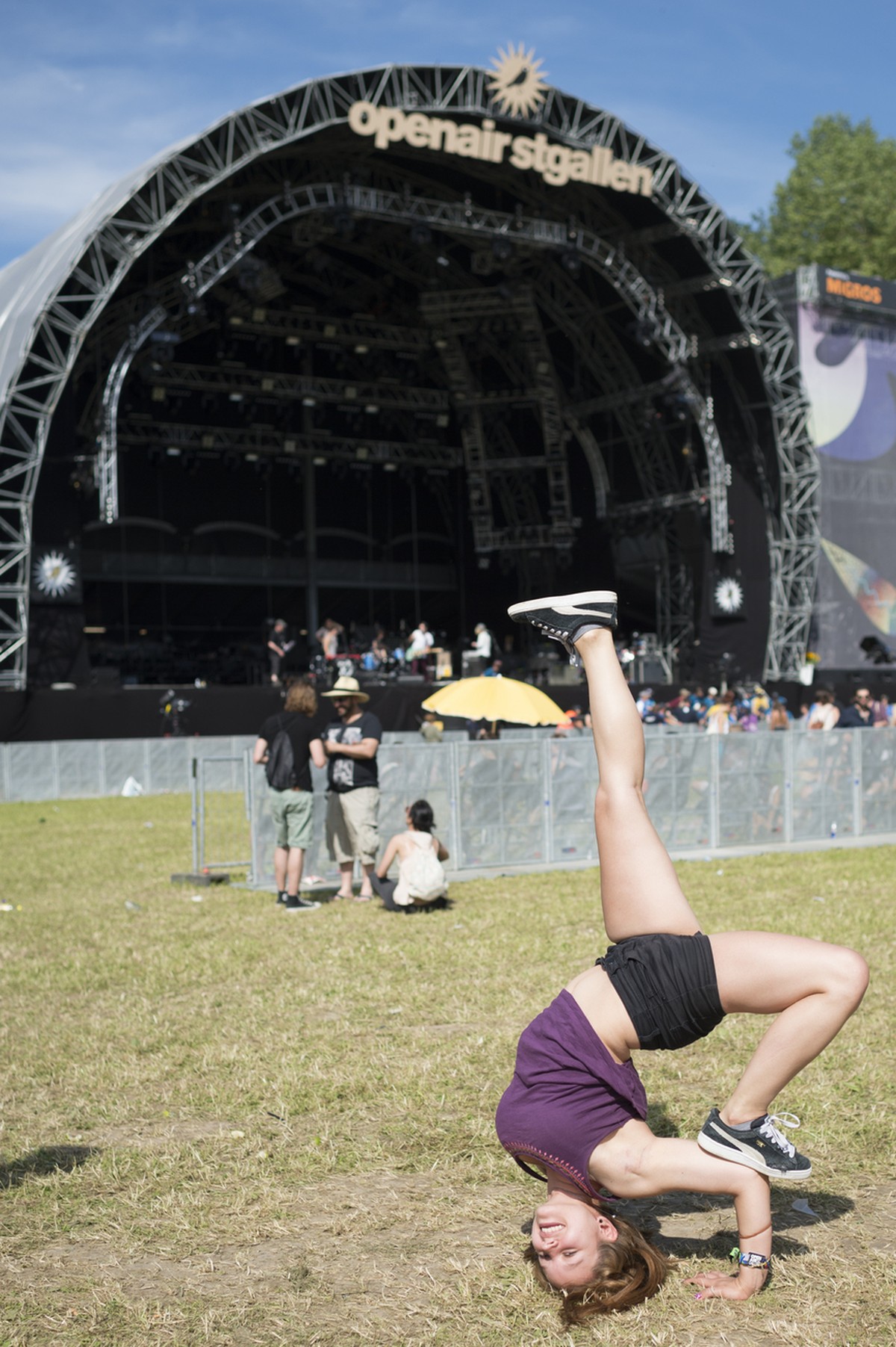 A visitor performs breakdance in front of the main stage during the music festival Openair St. Gallen, on Friday, June 26, 2015, in St. Gallen, Switzerland. (KEYSTONE/Gian Ehrenzeller)