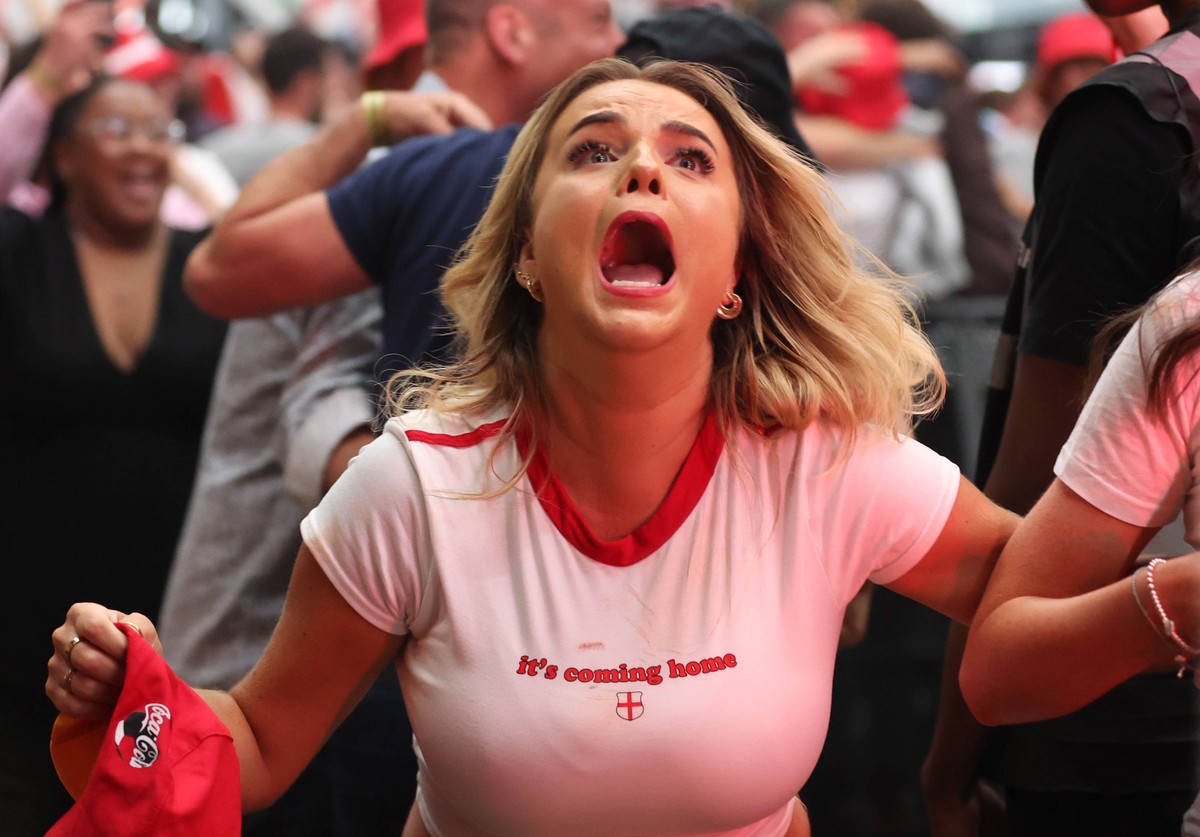 Fans watching England v Slovakia - EUFA Euro 2024 England fans at BOXPark Wembley in London celebrate after England s Jude Bellingham scores a late equaliser during a screening of the UEFA EURO, EM, E ...