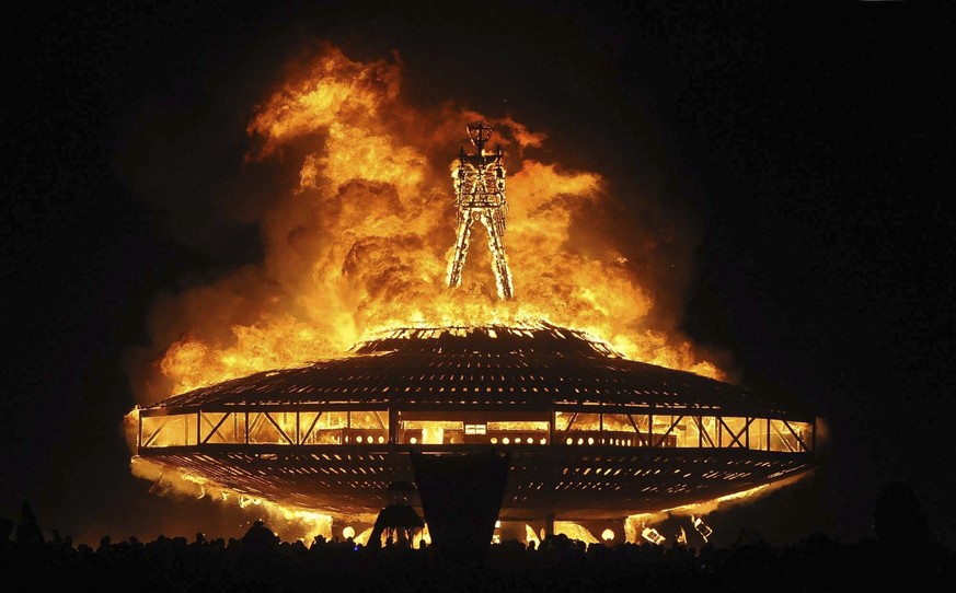 FILE - In this Aug. 31, 2013, file photo, the &quot;Man&quot; burns on the Black Rock Desert at Burning Man near Gerlach, Nev. A Nevada sheriff says the man who ran into the flames at the Burning Man  ...