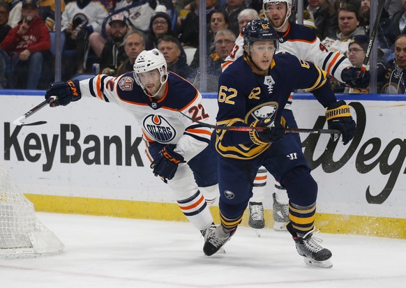 Buffalo Sabres defenseman Brandon Montour (62) skates past Edmonton Oilers forward Tobias Rieder (22) during the second period of an NHL hockey game, Monday, March 4, 2019, in Buffalo N.Y. (AP Photo/J ...