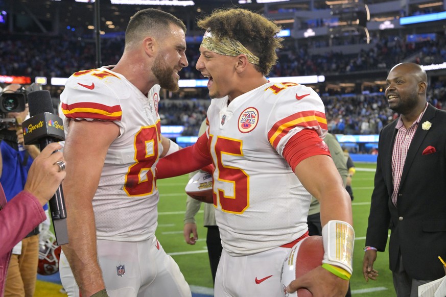 Kansas City Chiefs tight end Travis Kelce, left, and quarterback Patrick Mahomes celebrate after the Chiefs defeated the Los Angeles Chargers 30-27 in an NFL football game Sunday, Nov. 20, 2022, in In ...