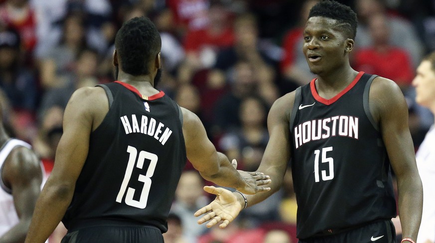 Houston Rockets center Clint Capela (15) shakes guard James Harden&#039;s hand after drawing a foul during the second half of an NBA basketball game against the Brooklyn Nets, Monday, Nov. 27, 2017, i ...