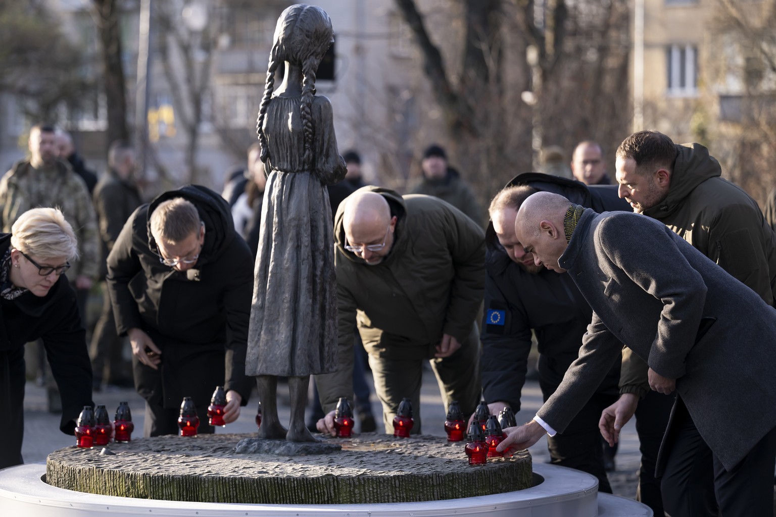 Alain Berset, President of the Swiss Confederation, right, lays down a candle during the commemoration ceremony of the Holodomor?s victims (1932-1933) in Ukraine, at National Museum of the Holodomor-G ...