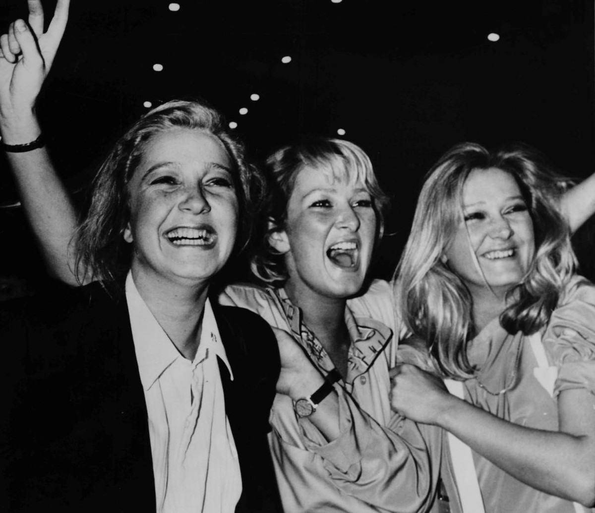 The three daughters of French far right leader Jean Marie Le Pen (unseen), from left: Marine, Yanne and Marie Caroline, are all smiling after the results of the French legislative and regional electio ...