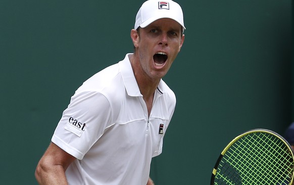 United States' Sam Querrey celebrates after beating Australia's John Millman in a Men's singles match during day six of the Wimbledon Tennis Championships in London, Saturday, July 6, 2 ...