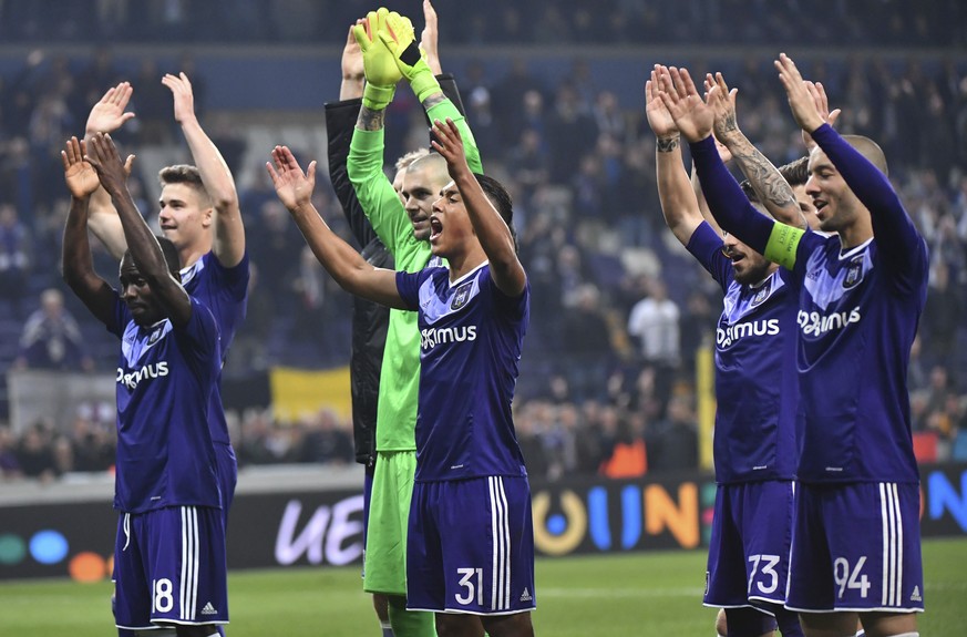 Anderlecht players celebrate after winning their Europa League round of 16, second leg, soccer match between Anderlecht and APOEL at the Constant Vanden Stock stadium in Brussels, on Thursday, March 1 ...