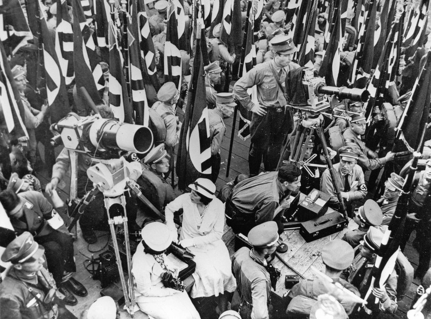 Jan. 1, 1934 - Nuremberg, Germany - Controversial film-maker LENI RIEFENSTAHL (center, in a white dress) pictured during shooting the Nazi propaganda film Triumph of the Will, a documentary glorifying ...