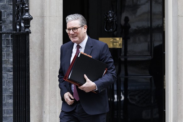 epaselect epa11890263 British Prime Minister Keir Starmer departs his official residence at 10 Downing Street to appear at Prime Minister&#039;s Questions (PMQs) at Parliament in London, Britain, 12 F ...