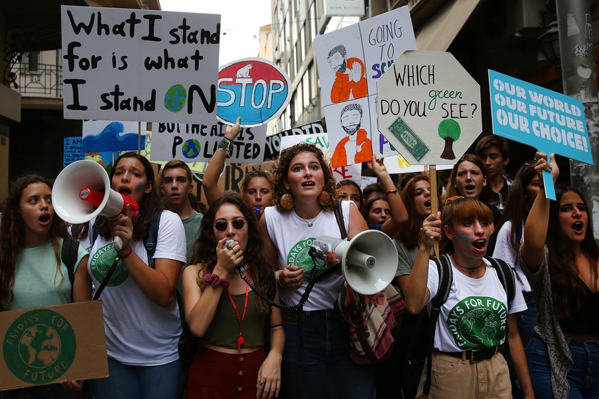 epa07855988 Protesting school students call for climate change action during a Global Strike 4 Climate rally at Syntagma Square in Athens, Greece, 20 September 2019. The Global Strike 4 Climate is bei ...