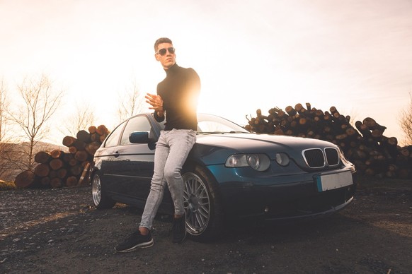 man with sports car