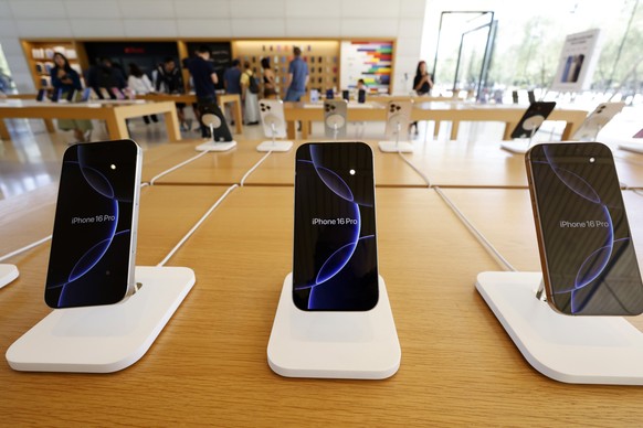 epa12271524 An Apple iPhone 16 Pro on display at the Apple store in the Apple Park Visitor Center across the street from Apple Inc., headquarters in Cupertino, California, USA, 29 July 2025. Apple Inc ...