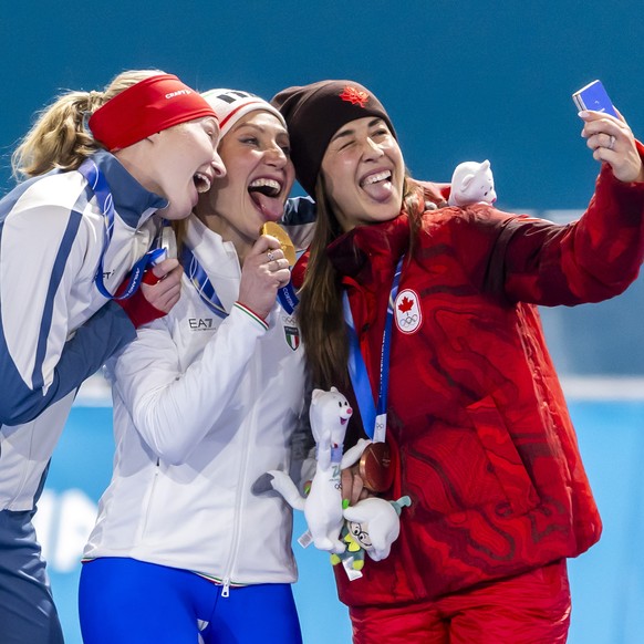 epa12713620 Gold medalist Francesca Lollobrigida (C), silver medalist Ragne Wiklund (L), and bronze medalist Valerie Maltais (R) pose on the medal-ceremony podium after the womens 3000 metres speed s ...