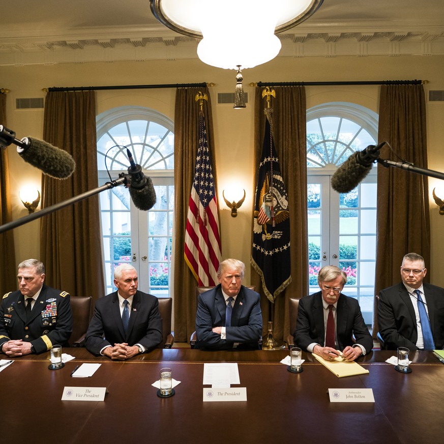 epaselect epa06658048 US President Donald J. Trump (C) speaks with the media before a meeting with his military leadership in the Cabinet Room of the White House in Washington DC, USA, 09 April 2018.  ...
