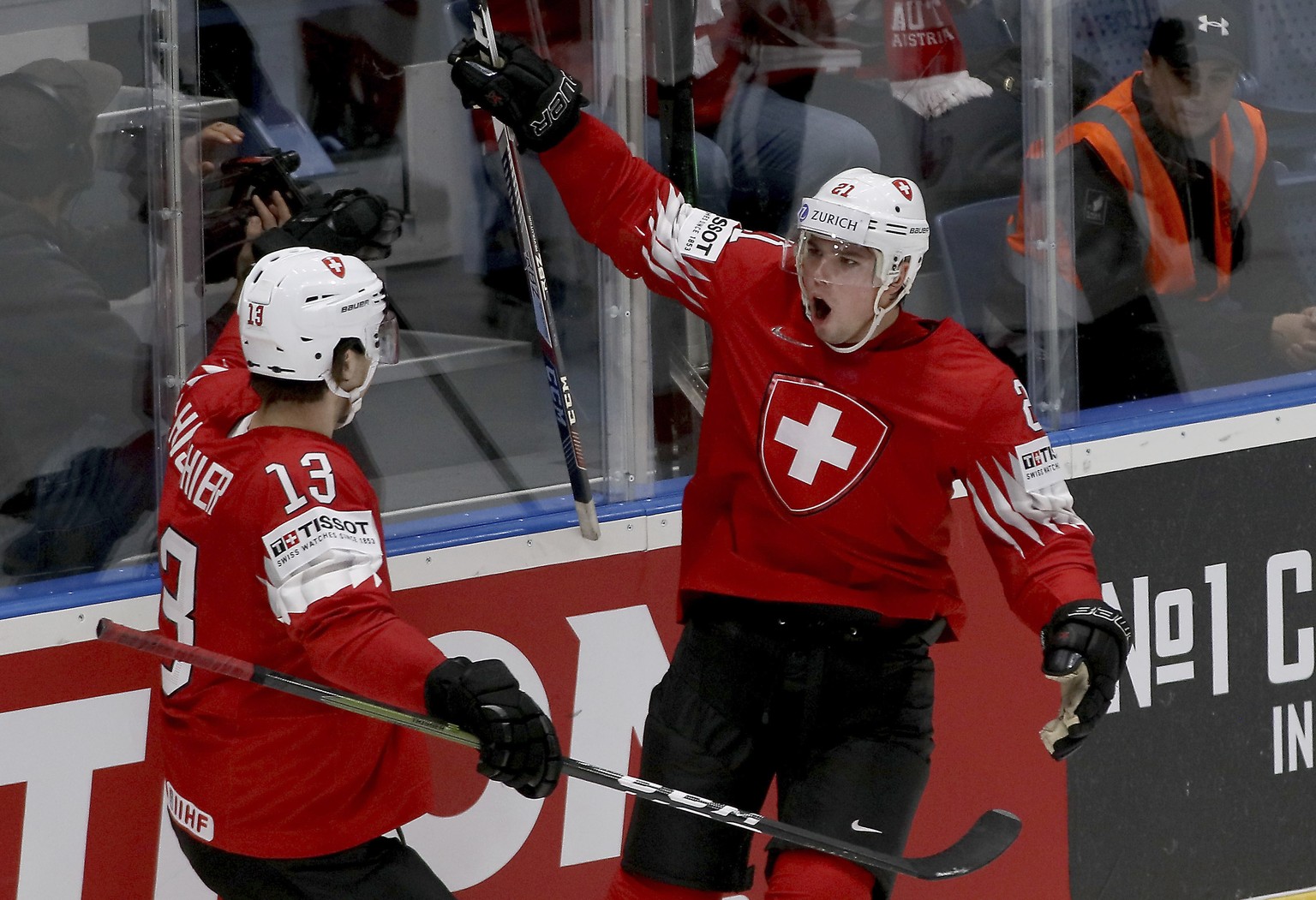 Swiss scorer Kevin Fiala, right reacts with Nico Hischier during the Ice Hockey World Championships group B match between Switzerland and Austria at the Ondrej Nepela Arena in Bratislava, Slovakia, Tu ...