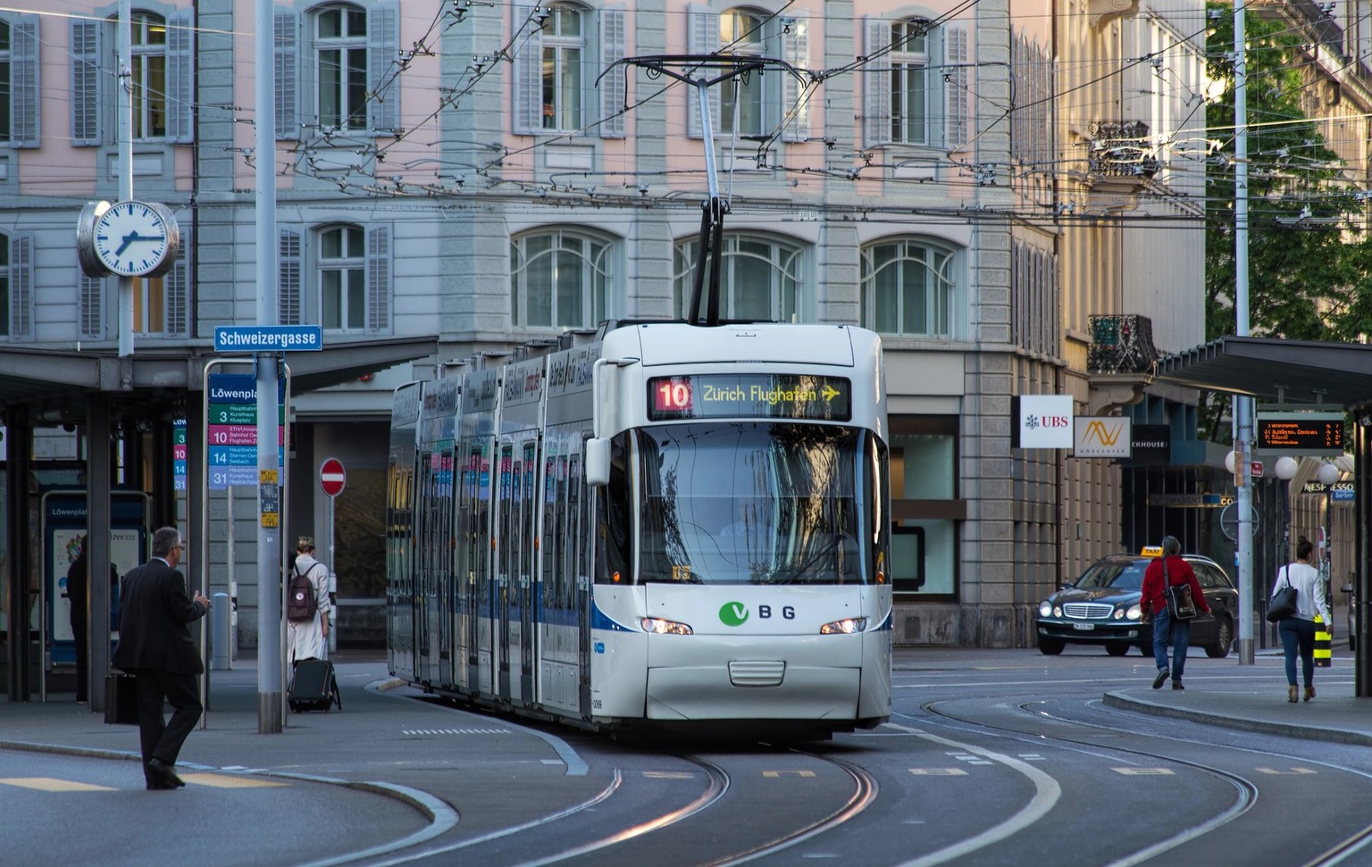 Zurich, Switzerland - 8 May, 2015: tram at Loewenplatz stop, view from the Loewenstrasse street in the morning. Zurich is the largest city in Switzerland and the capital of the Canton of Zurich.