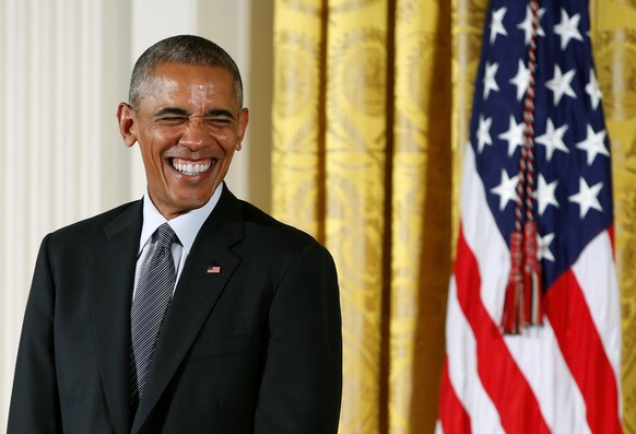 U.S. President Barack Obama laughs while awarding the 2015 National Medal of Arts and 2015 National Humanities Medals at the White House in Washington, U.S., September 22, 2016. REUTERS/Gary Cameron