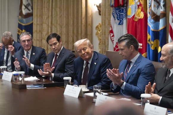 Cabinet members applaud President Donald Trump, center, during a cabinet meeting at the White House, Tuesday, Aug. 26, 2025, in Washington. (AP Photo/Mark Schiefelbein)
Donald Trump