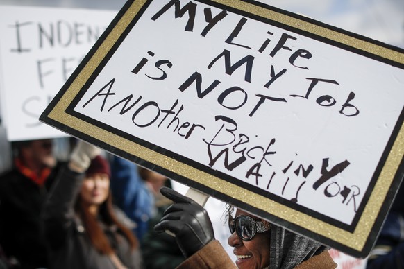 Union members and Internal Revenue Service workers rally outside an IRS Service Center to call for an end to the partial government shutdown, Thursday, Jan. 10, 2019, in Covington, Ky. (AP Photo/John  ...