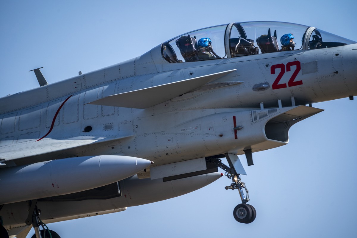 Pilots take off in a J-10 fighter jet at a training base for China's People's Liberation Army (PLA) naval aviation force in Ningbo in eastern China's Zhejiang Province, Thursday, Jan. 1 ...